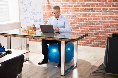 businessman on exercise ball