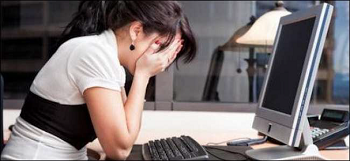 Woman upset in front of the computer